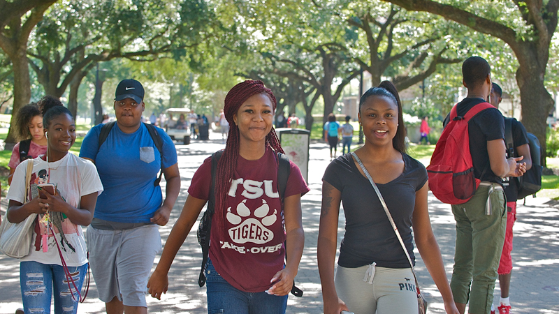 Walking two female students on campus