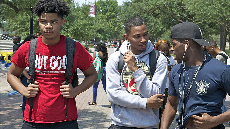 Male students walking on campus