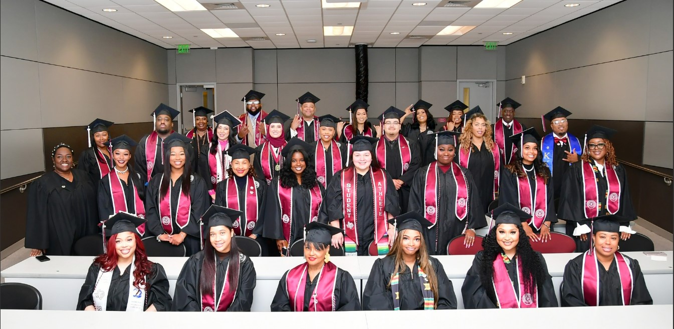 Students smiling in group photo