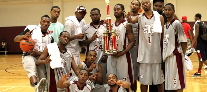 Men's basketball team in gym