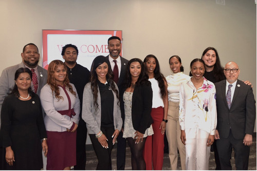 Dr. Pollard's son the Honorable Edward Pollard poses with honors college students