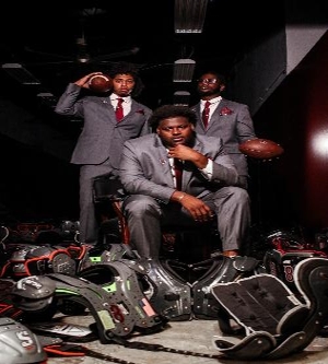 student athletes wearing custom suits